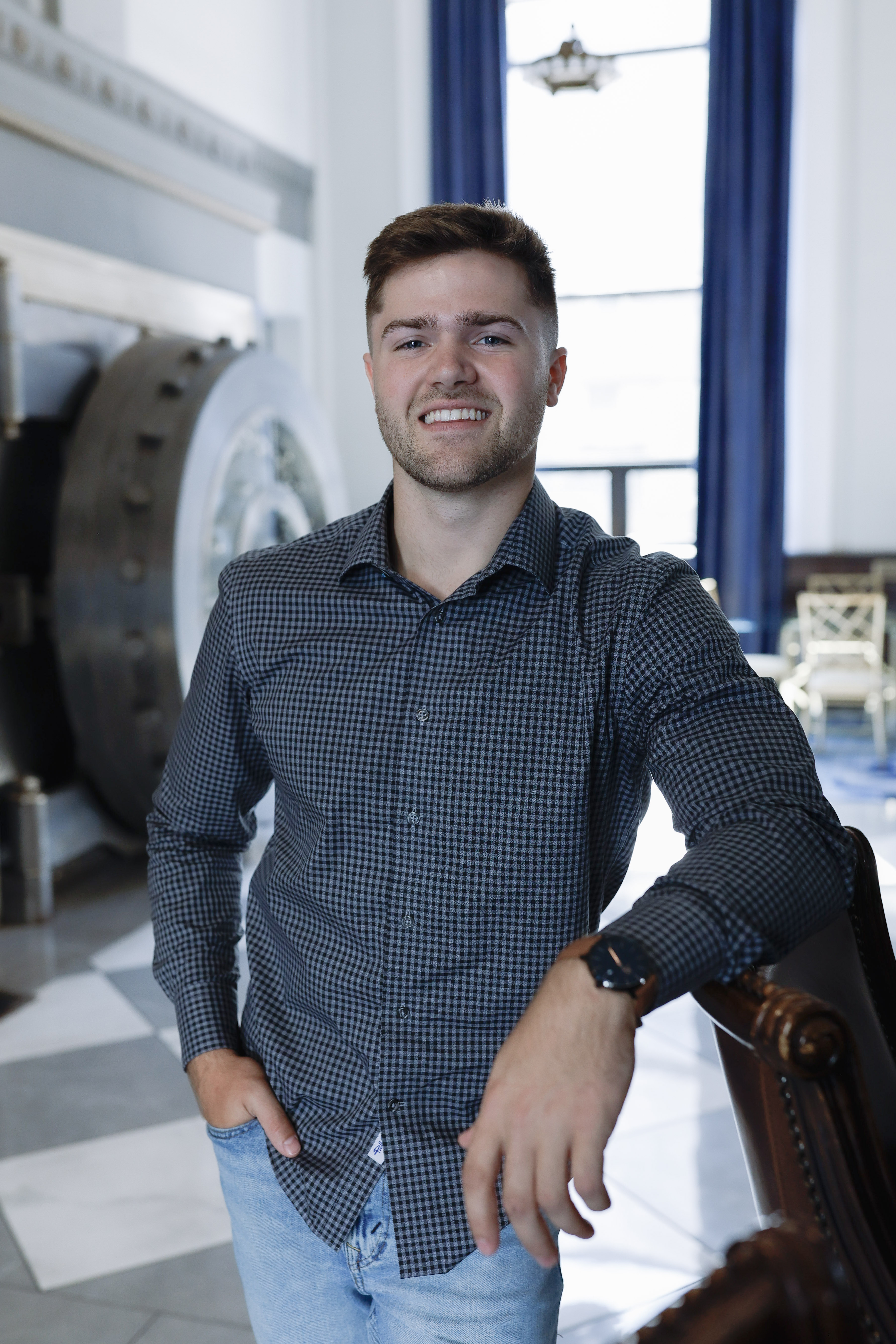 Tyce Ortman smiling in a professional portrait.