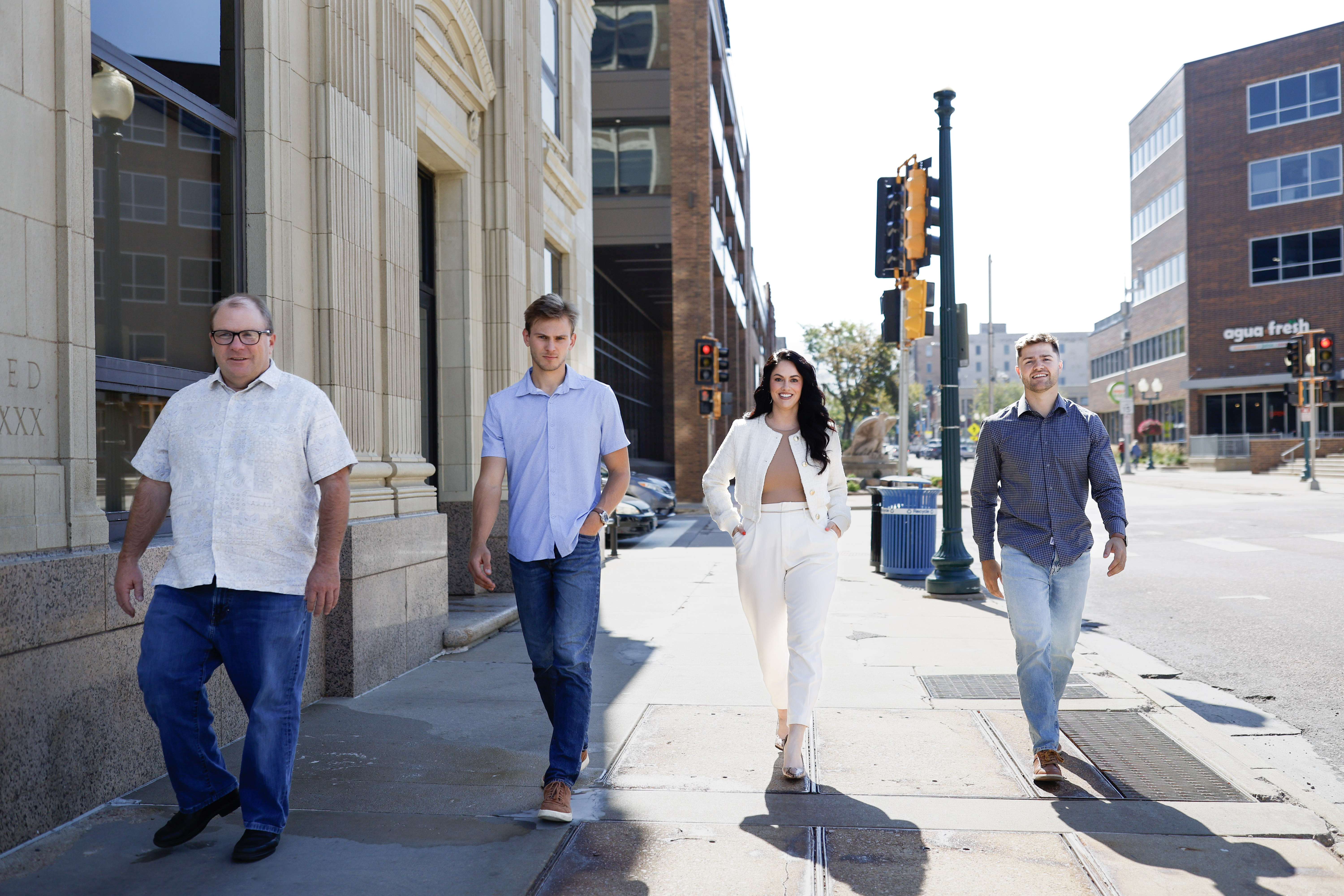 Team walking together outdoors on sunny day